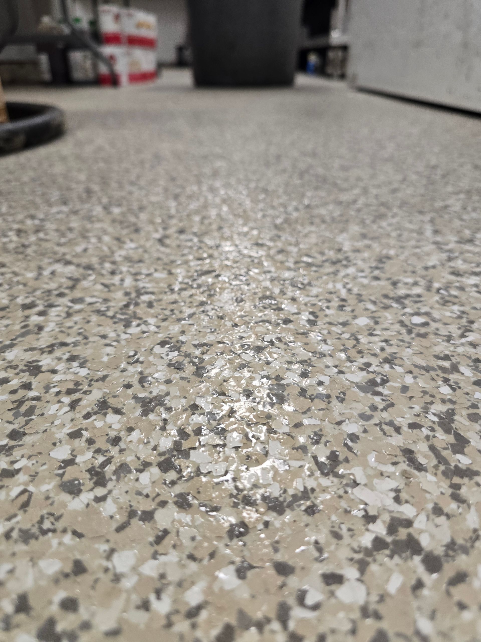 Close-up of speckled gray terrazzo floor in an indoor room