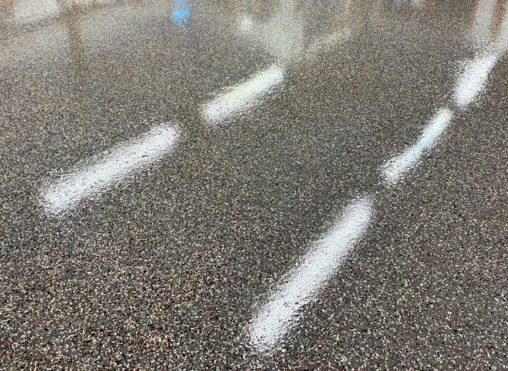 White lane markings on wet asphalt road surface