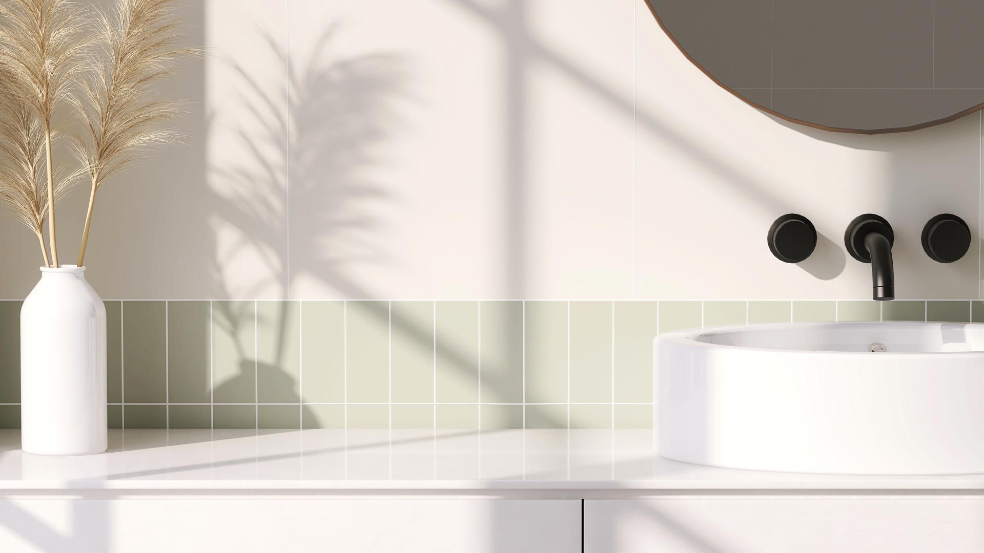 A bathroom with a sink , mirror , and vase.