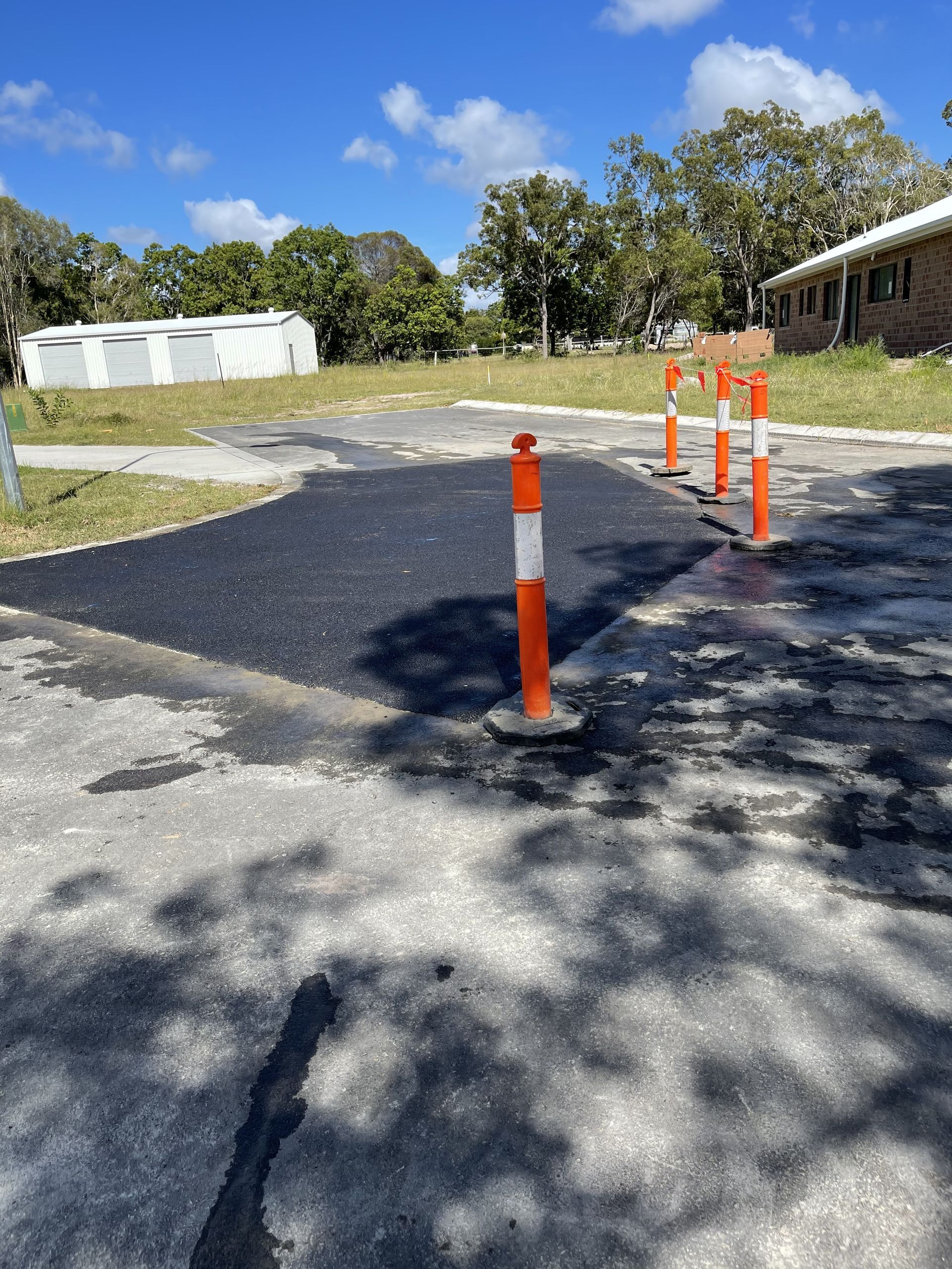 Fresh Asphalt on a trail with traffic cones — Appian Roads In Urangan, QLD