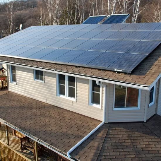 House roof covered with solar panels on a suburban home