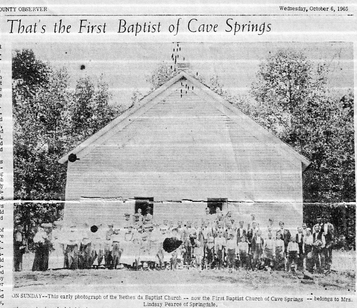 Black-and-white photo of First Baptist Church of Cave Springs with a crowd gathered outside.