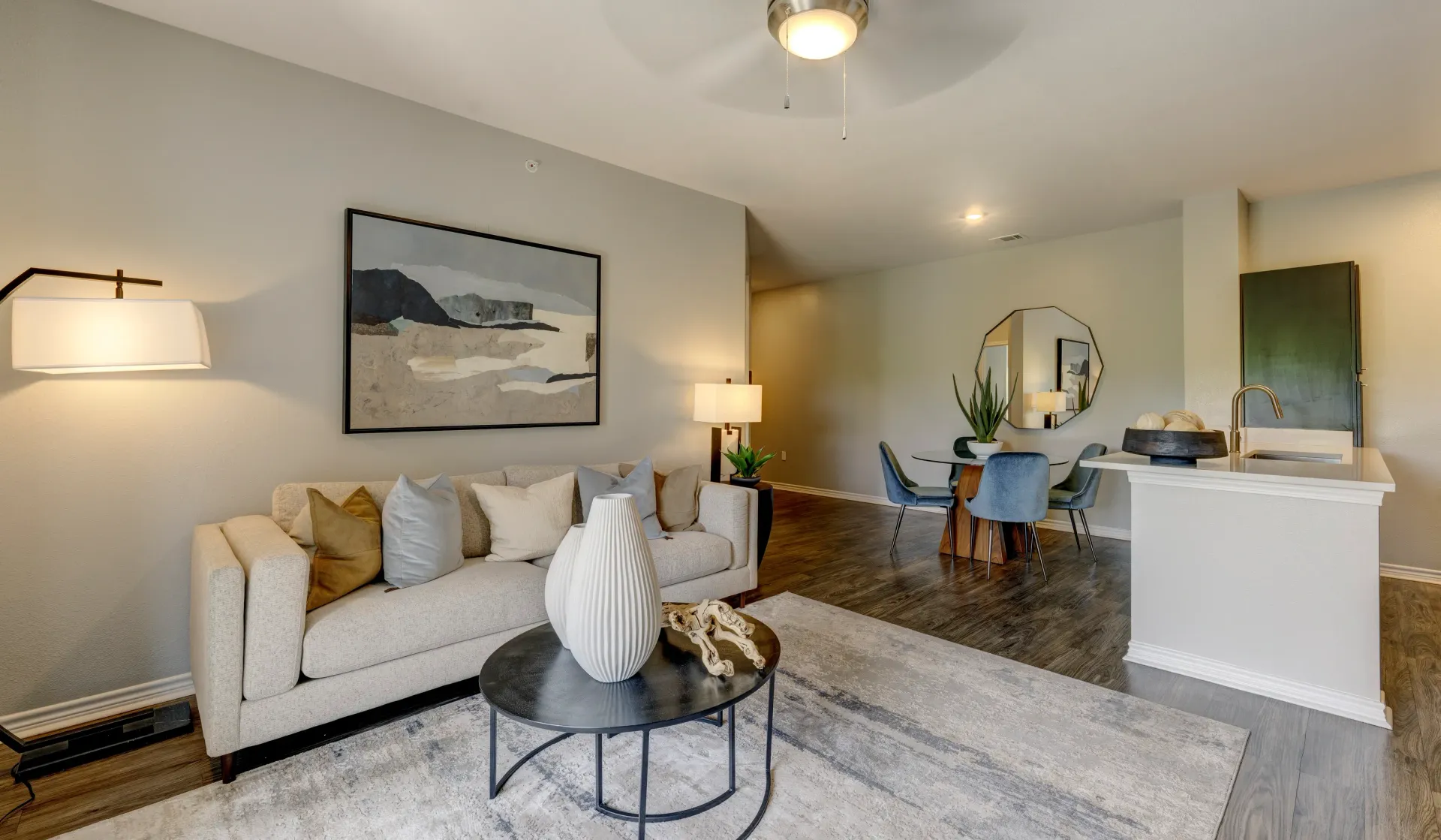 Living room with sofa, coffee table, and dining area