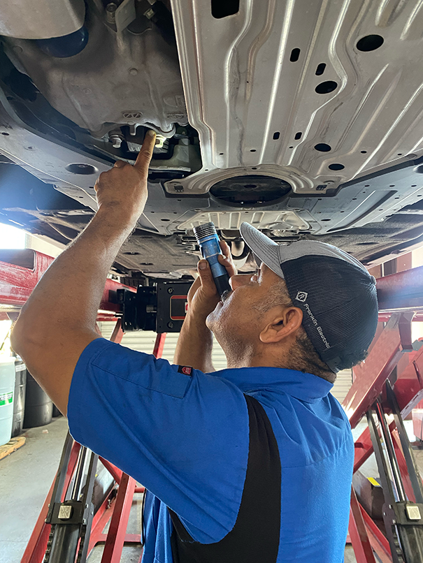 Technician Working on a car | Elite Auto Experts