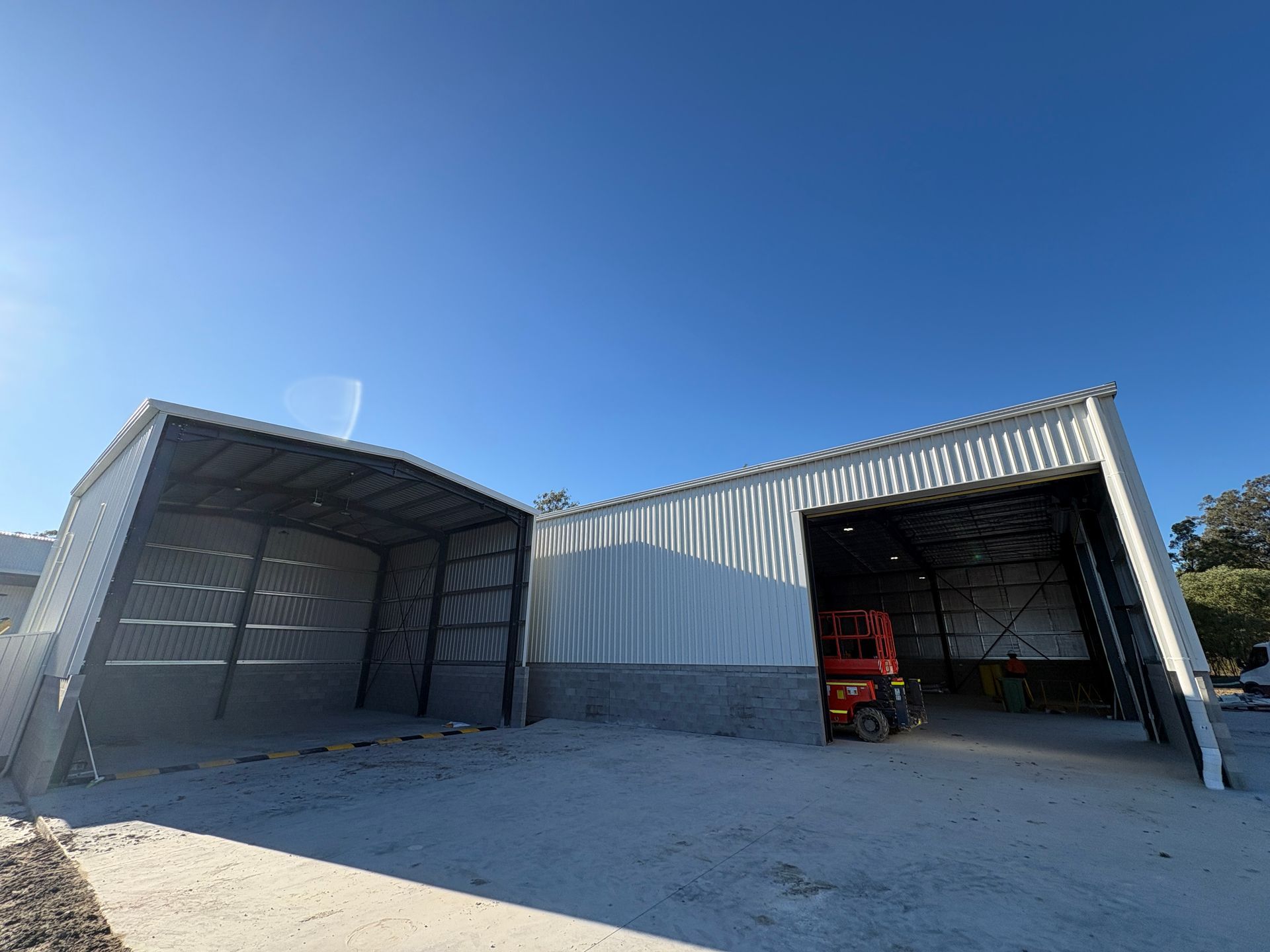 Two new shed installations for an industrial warehouse.
