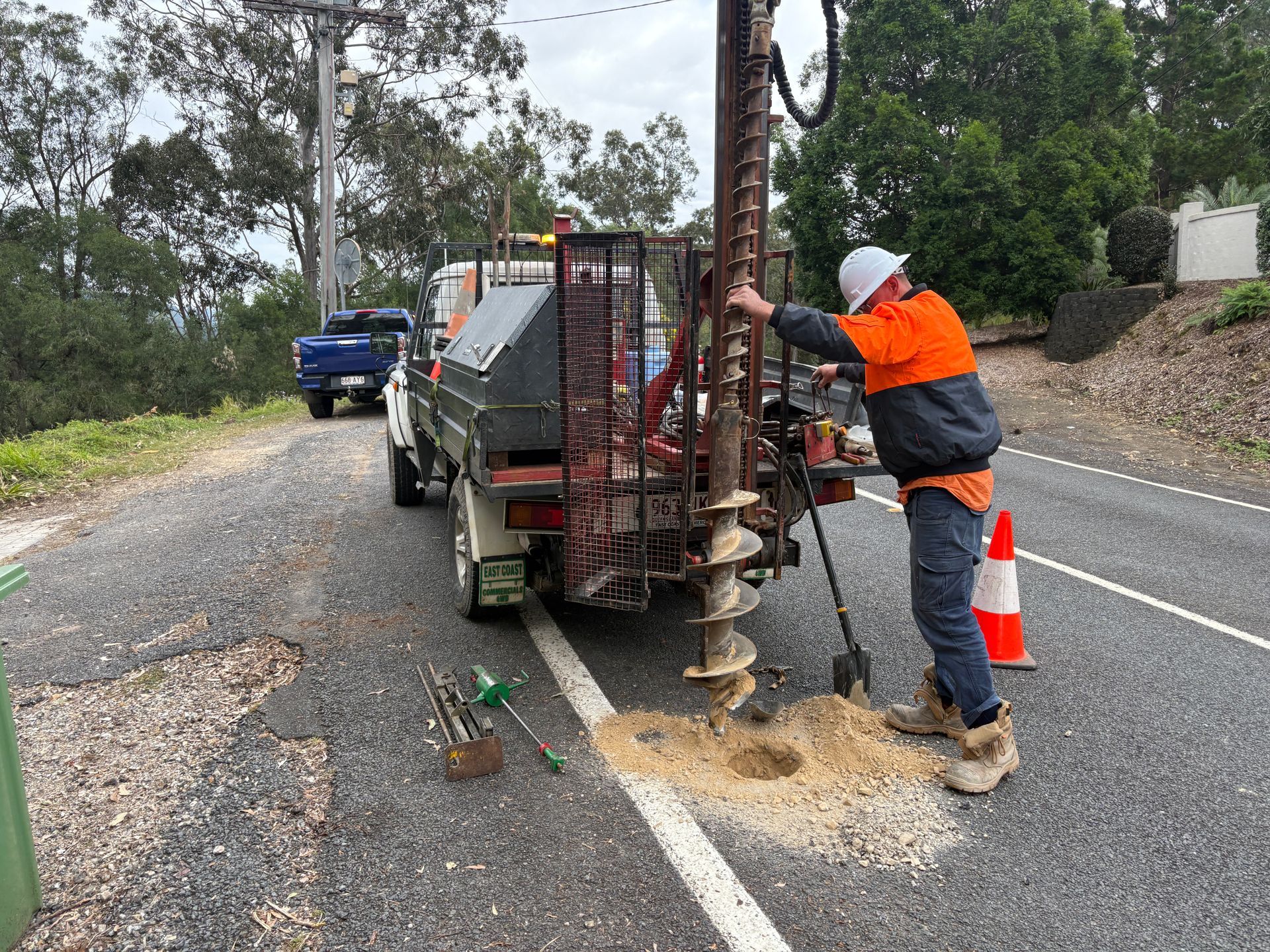 Geotechnical investigations occuring for a road upgrade.