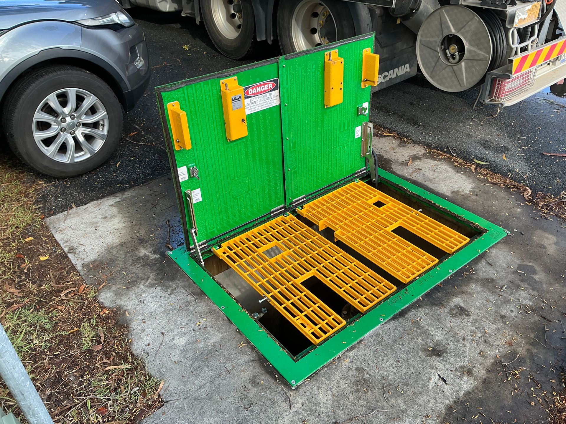 Open green hatch at a sewer pump station