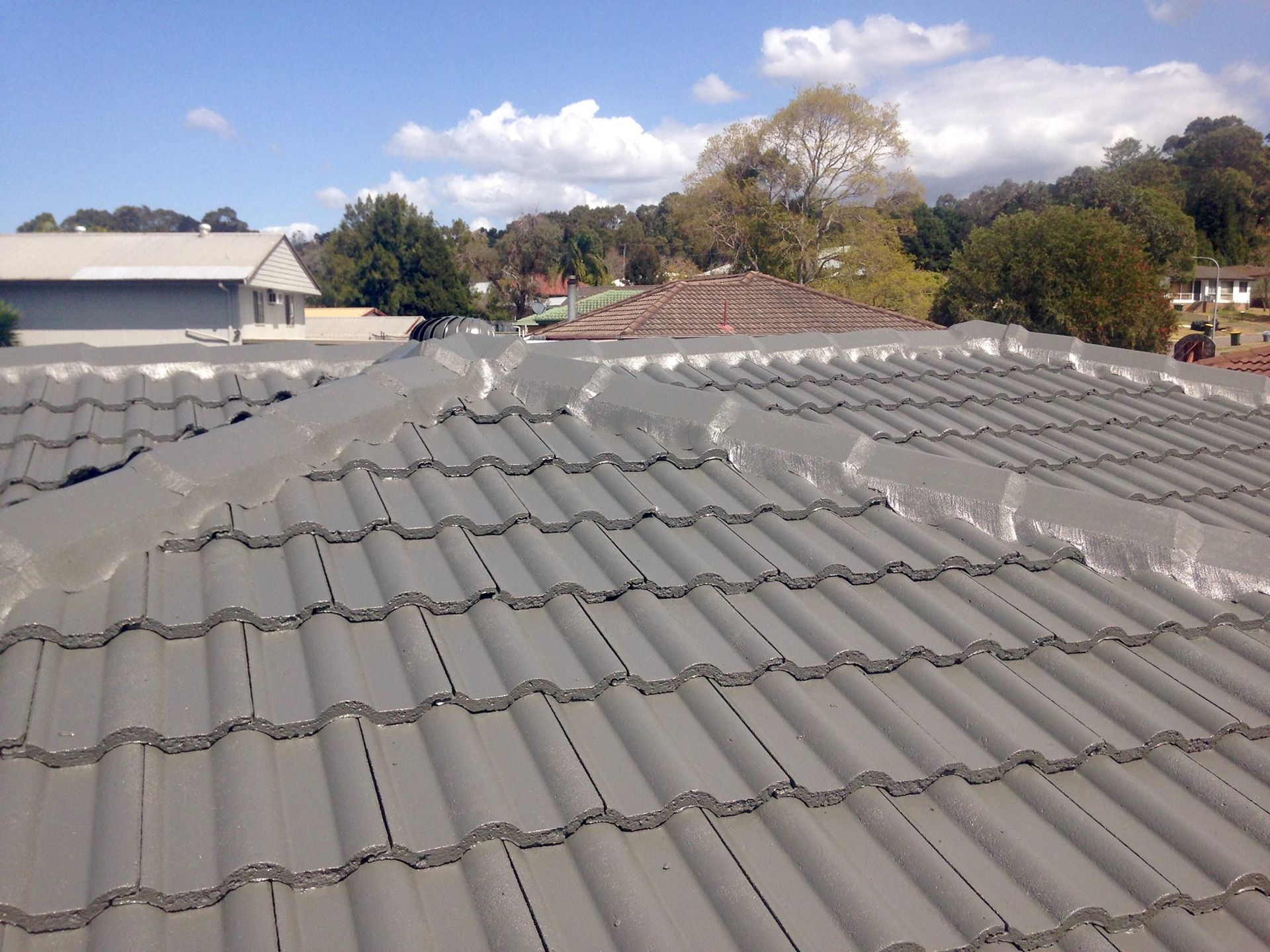 A Roof With A Lot Of Tiles On It — In-Time Roofing In Newcastle, NSW