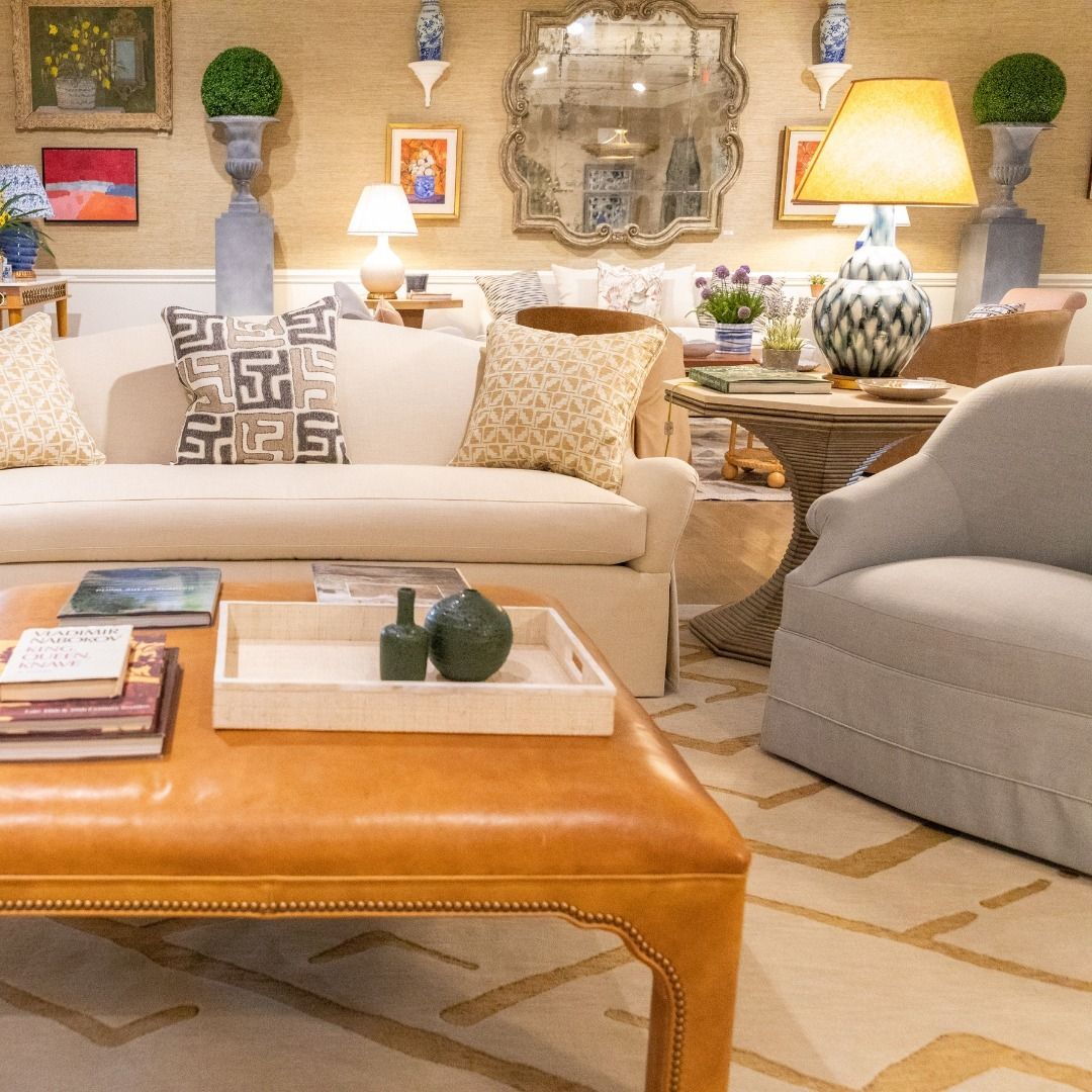 A living room with a couch a chair and a coffee table