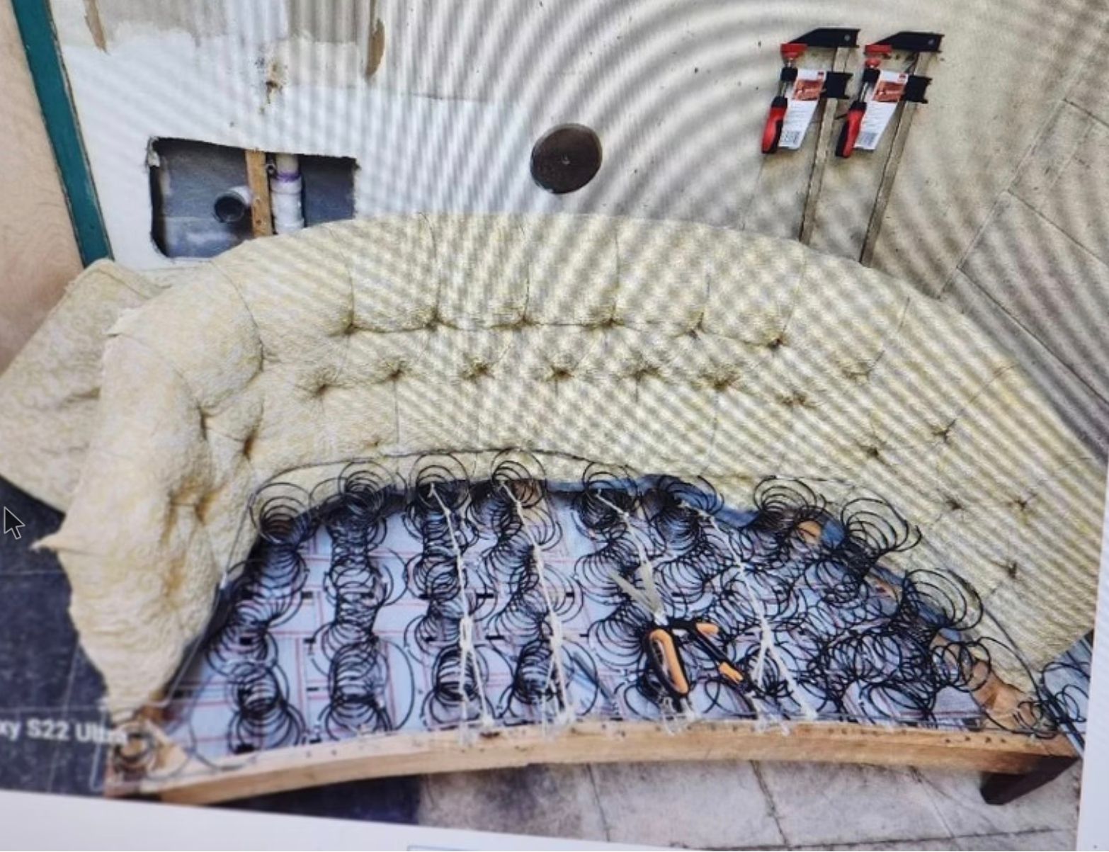A picture of a couch with springs on it