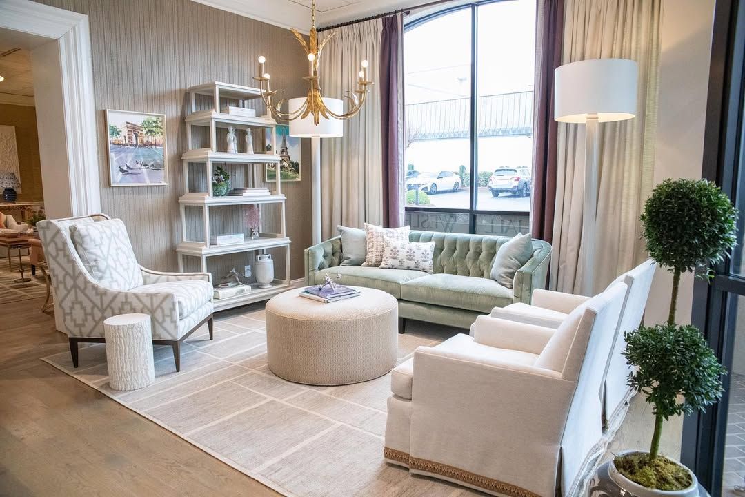 A living room filled with furniture and a large window.