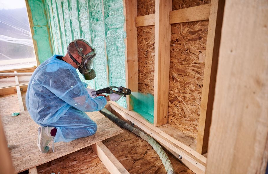 Contractor installing wall spray foam