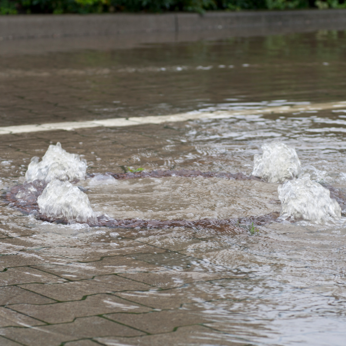 Picture of Water Overflowing from A Sewer | Grove City, OH | CST Utilities