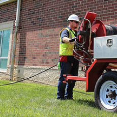 A Man Clearing Debris | Grove City, OH | CST Utilities A Man Clearing Debris | Grove City, OH | CST Utilities