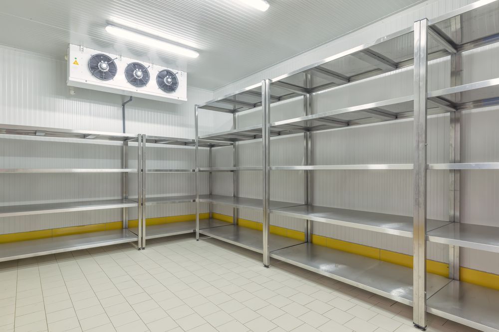 An Empty Refrigerator With Stainless Steel Shelves And A Fan — East Coast Air In Cessnock, NSW