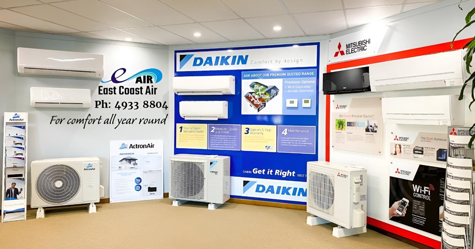A Room Filled With Air Conditioners And A Sign That Says Daikin On It — East Coast Air In East Maitland, NSW