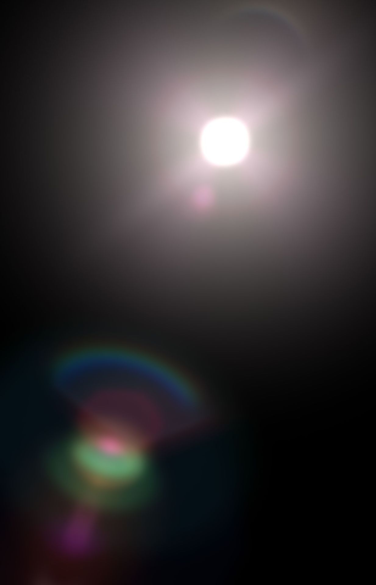 Person in car with bright sun in front of them