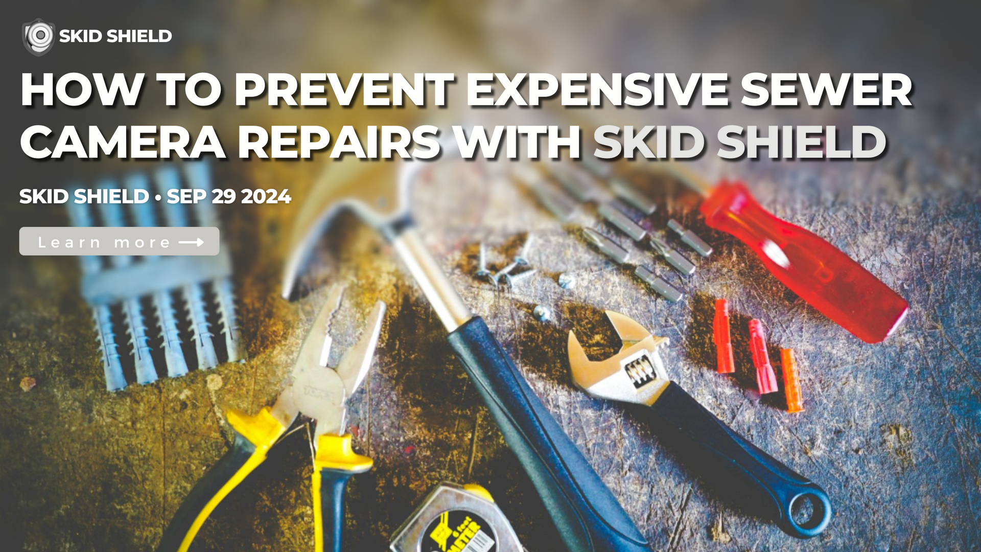 a set of tools on a worksurface used for repair, hammer, pliers, wrench, screwdriver