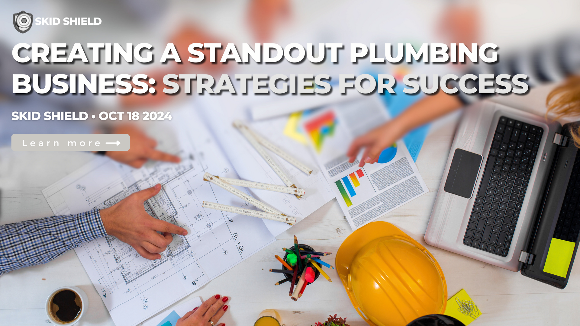 business plans, computers and statistics for a plumbing business on a table