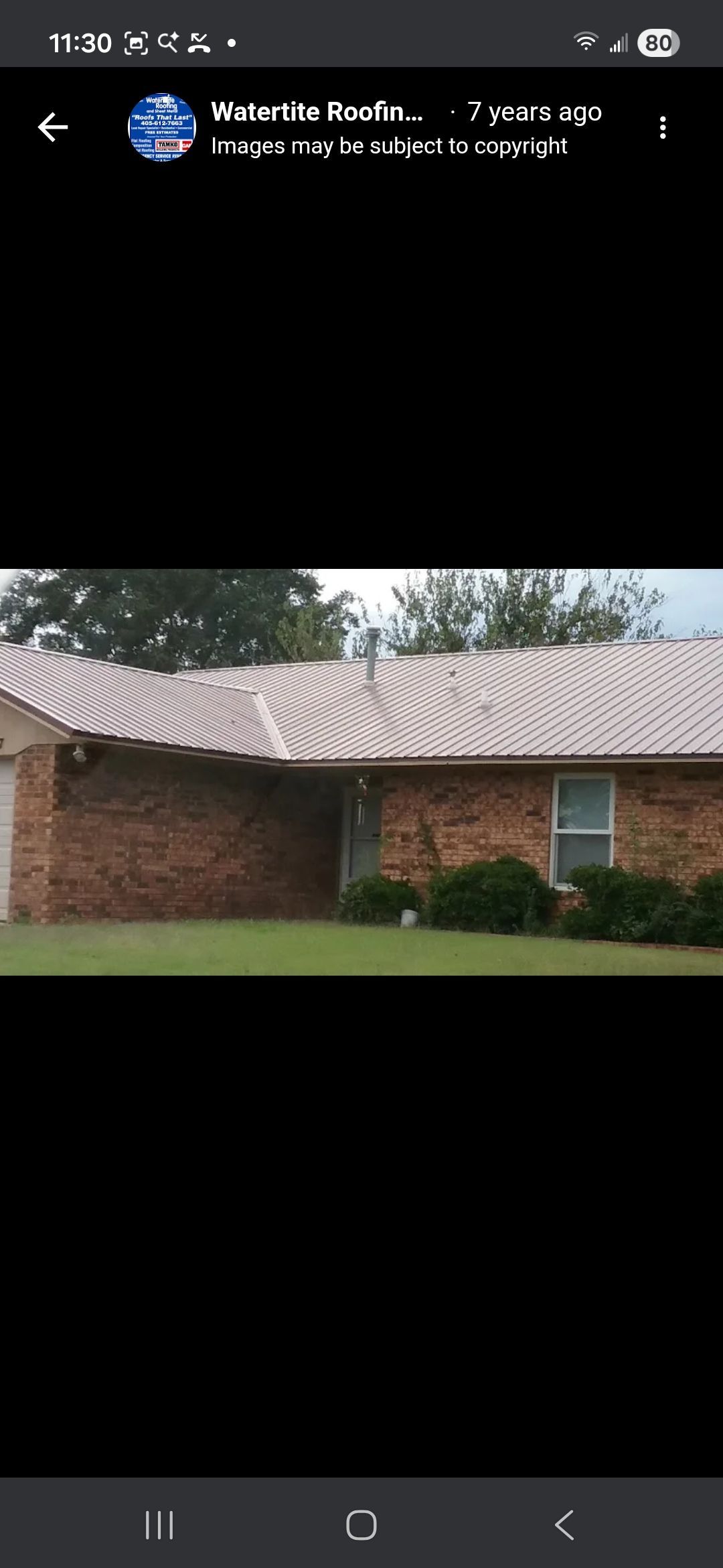 A brick house with a light metal roof and front lawn, seen in a social media screenshot.