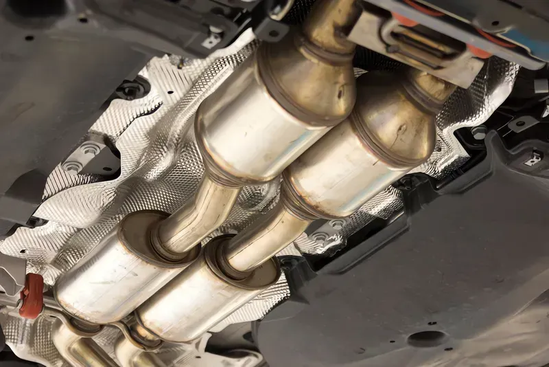 Underside of a Car Showing Dual Catalytic Converters and Exhaust System — Carline Automotive and Exhausts in Belmont, NSW