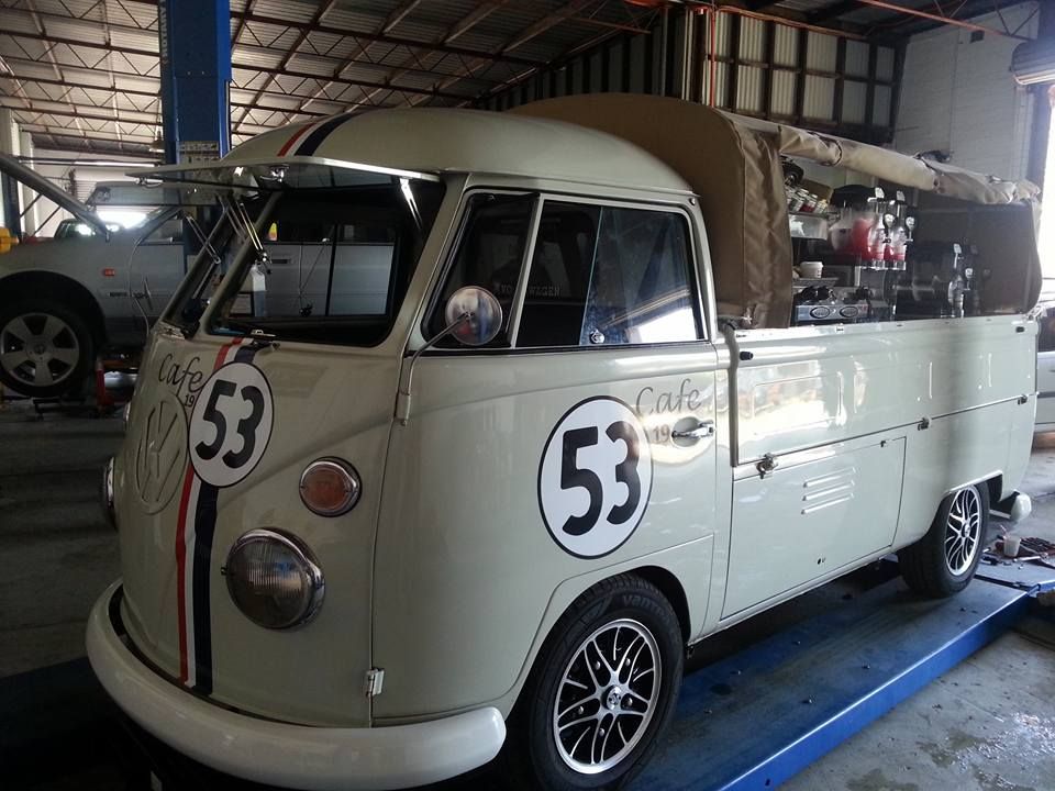 Beige Volkswagen bus, converted into a cafe, with racing stripes and number 53 — Carline Automotive and Exhausts in Belmont, NSW