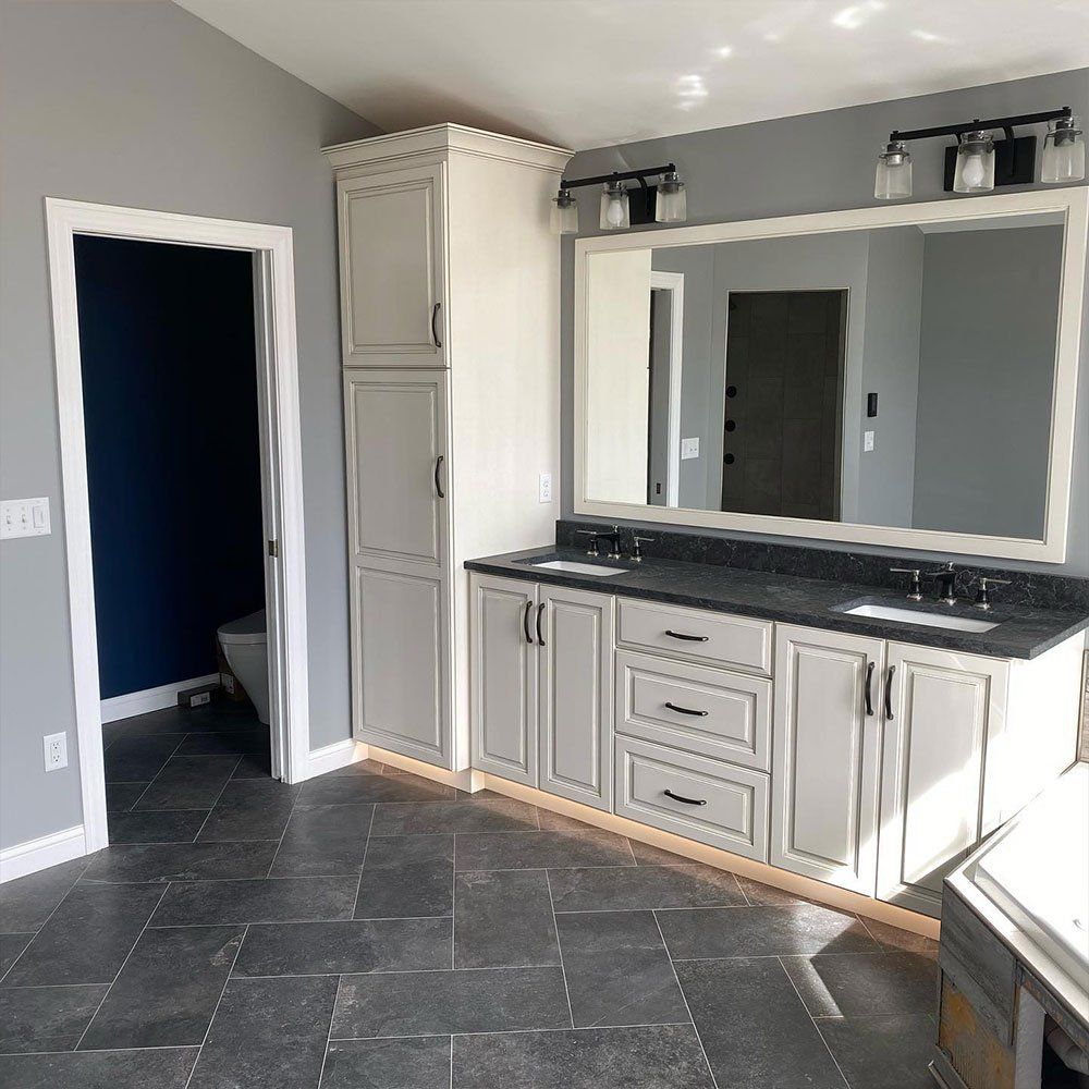 Large Bathroom With White Cabinets — Forrest, IL — Finishing Touch