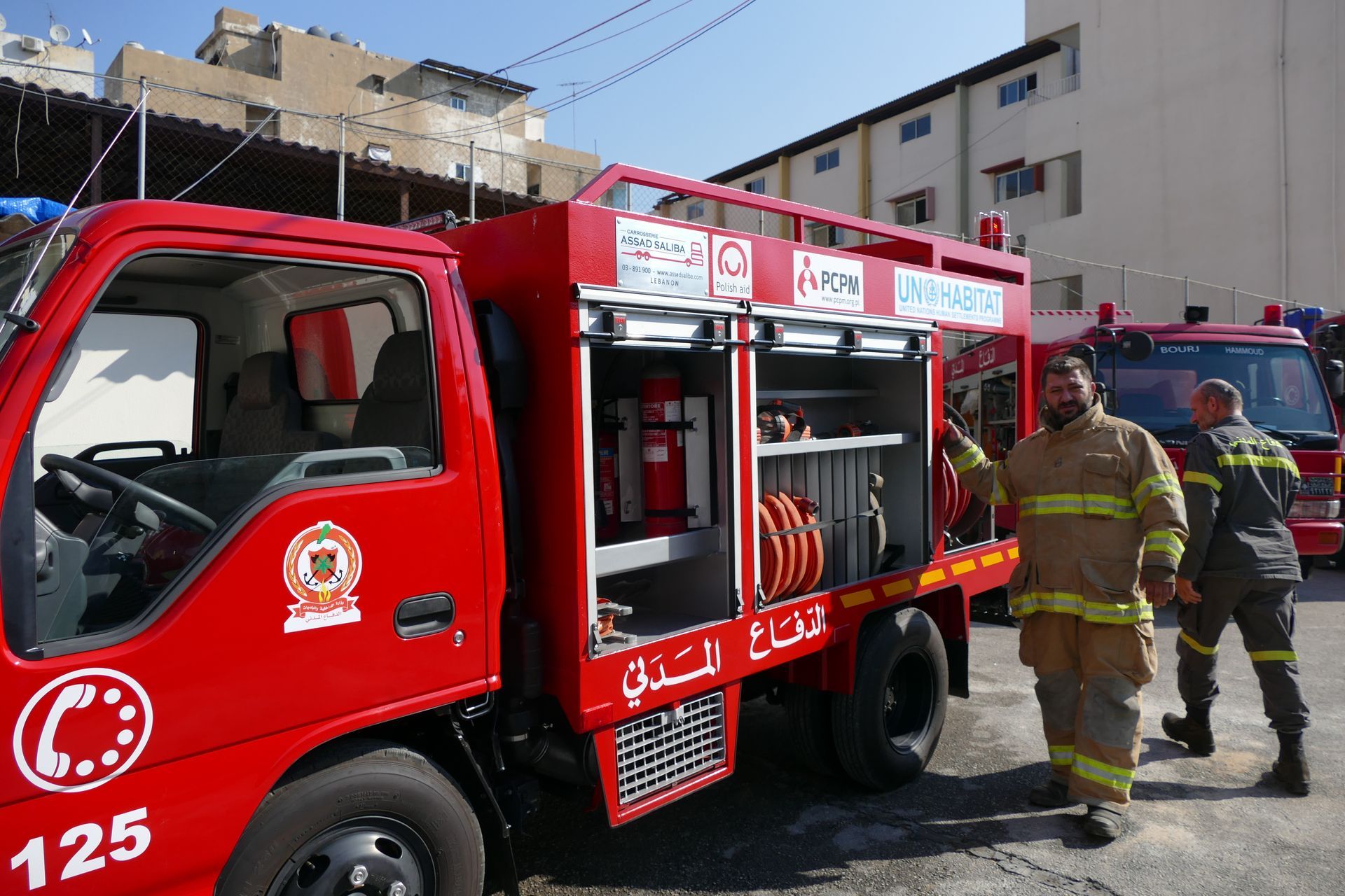 A red fire truck with the number 125 on the side