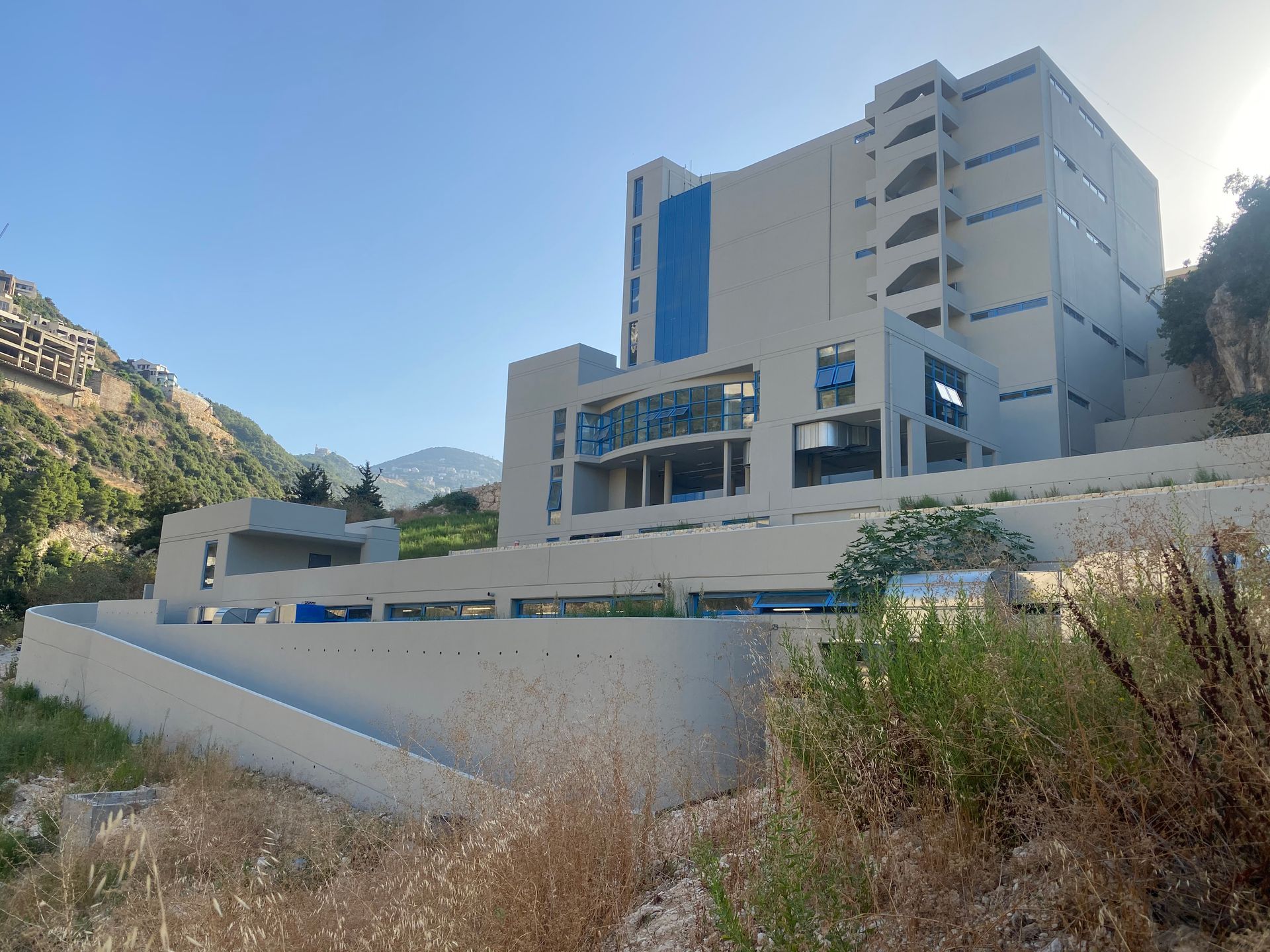 A large building with a blue sky in the background