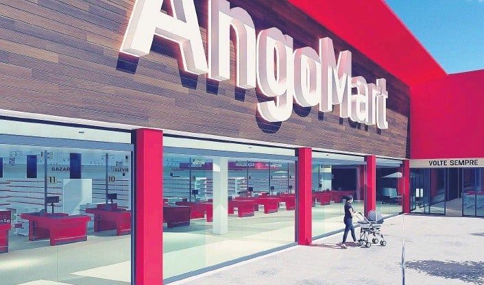 A person pushing a stroller in front of a store called angoman