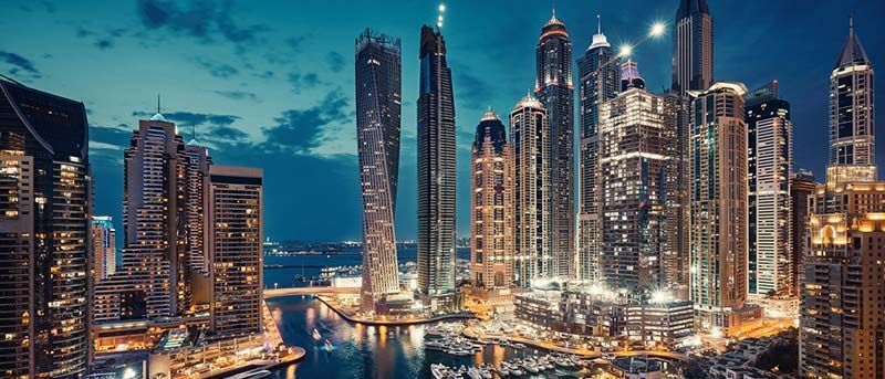 An aerial view of a city skyline at night.