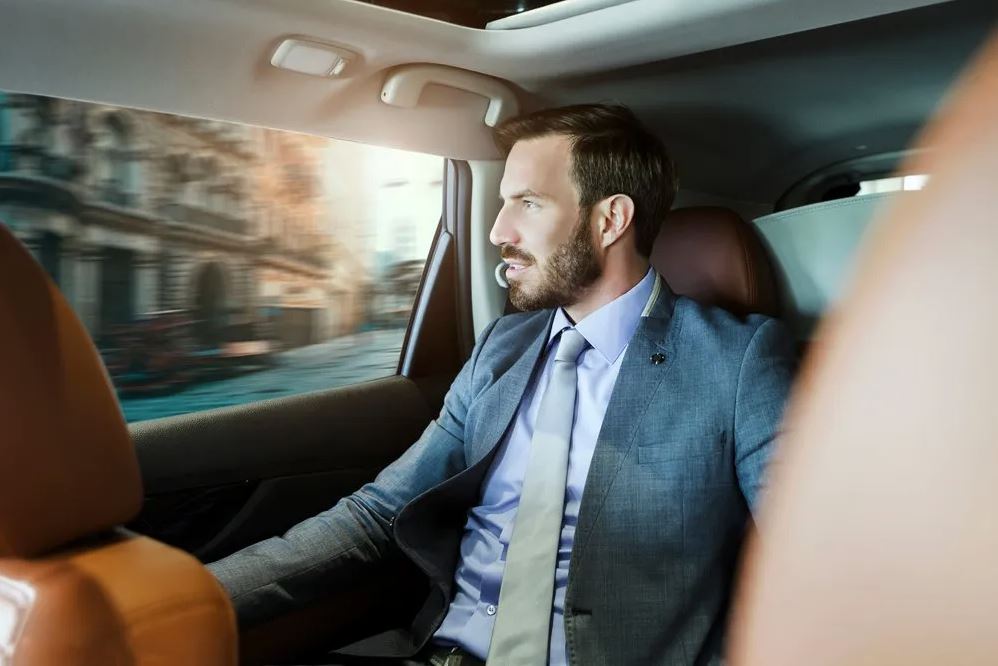 Businessman in a car looking out of the window