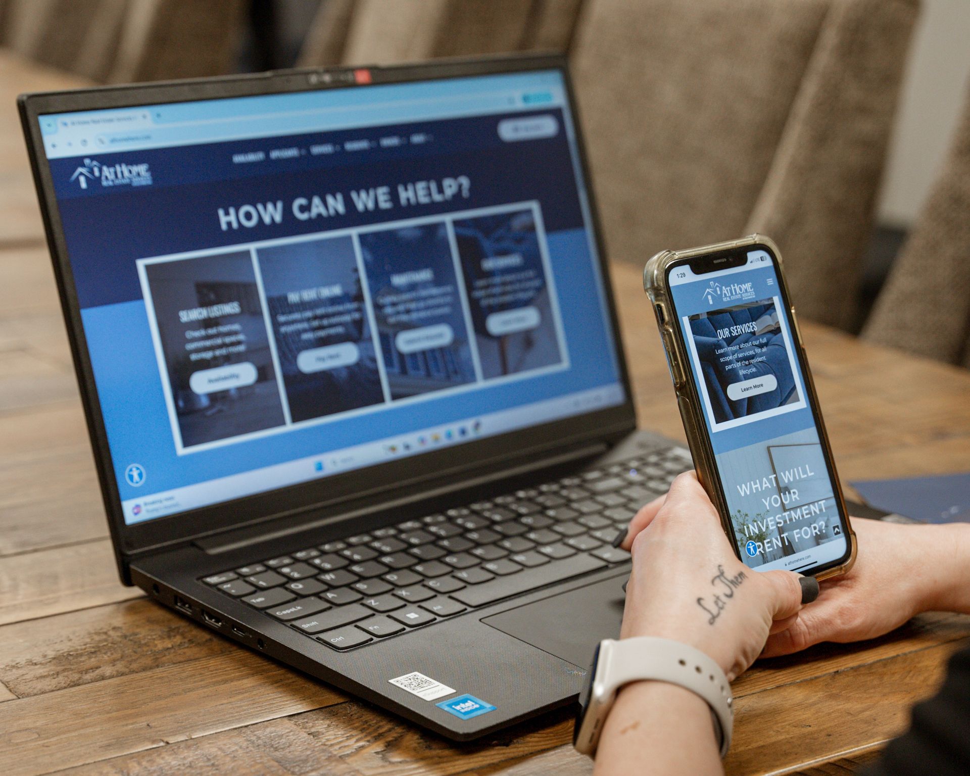 Phone and Laptop viewing the new At Home Real Estate Website
