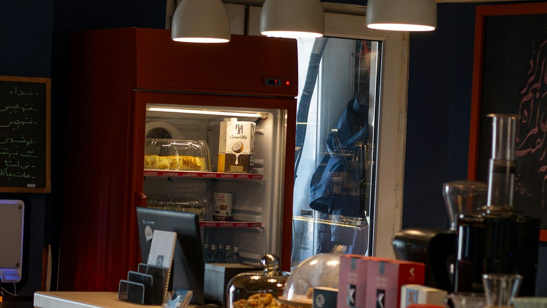 Professional café interior with commercial equipment and service counter