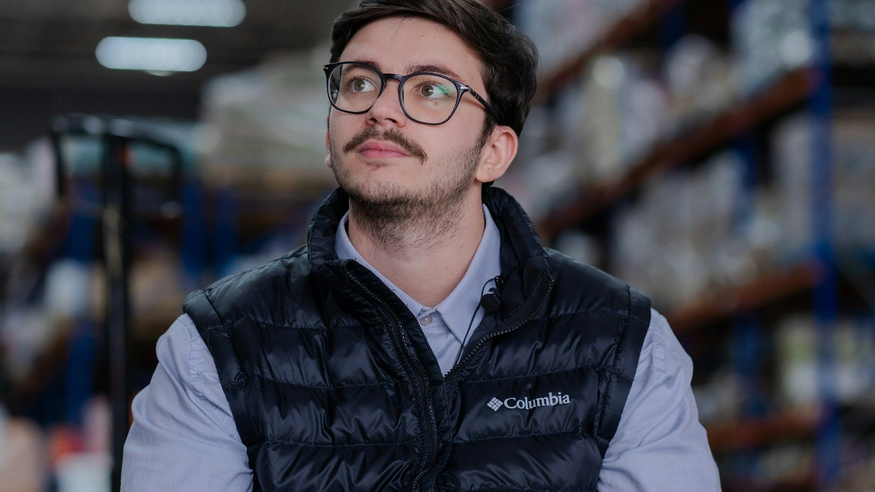 Logistics professional using a tablet while planning warehouse operations and delivery routes