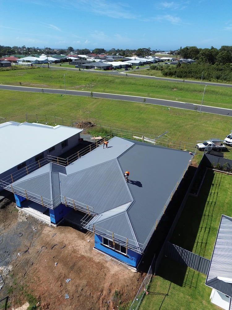 Aerial View of a House With a Grey Roof Under Construction — Ace1 Metal Roofing in Taree, NSW