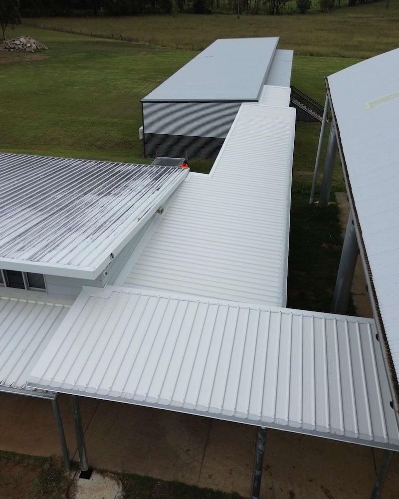 Overhead View of Several Connected Buildings With White Metal Roofs — Ace1 Metal Roofing in Laurieton, NSW