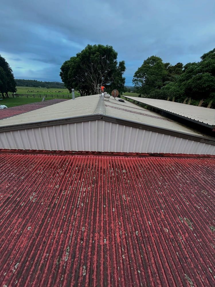 Red Corrugated Metal Roof of a Building — Ace1 Metal Roofing in Taree, NSW