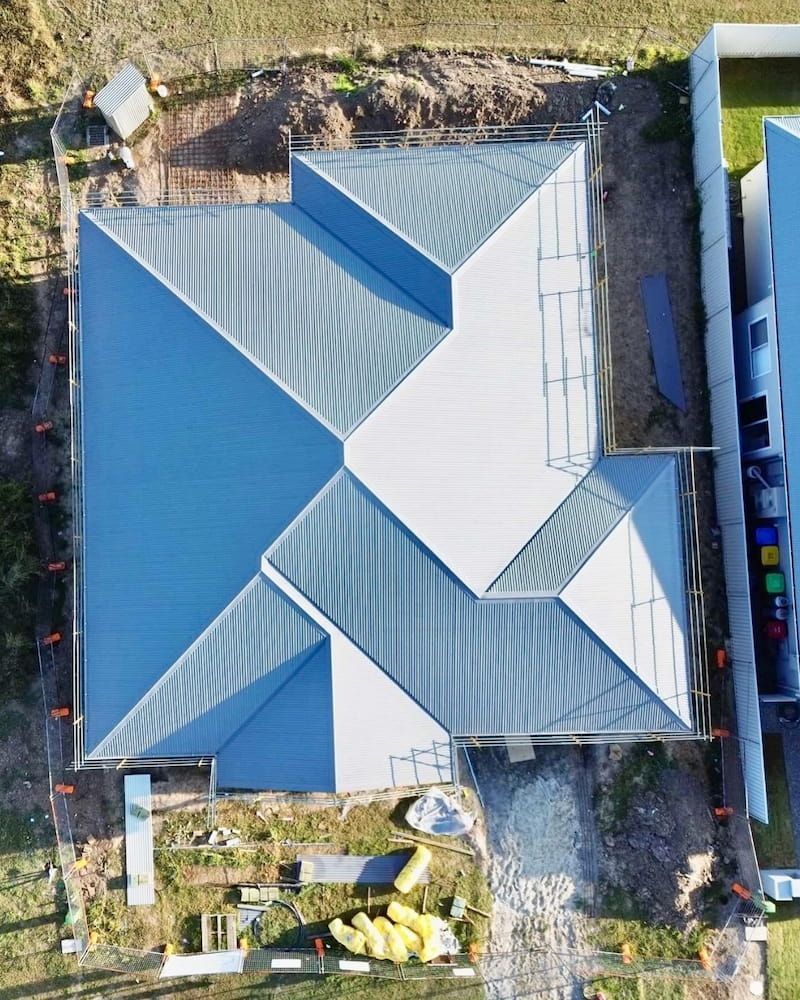 Overhead View of a House With a Grey Metal Roof Under Construction — Ace1 Metal Roofing in Forster, NSW