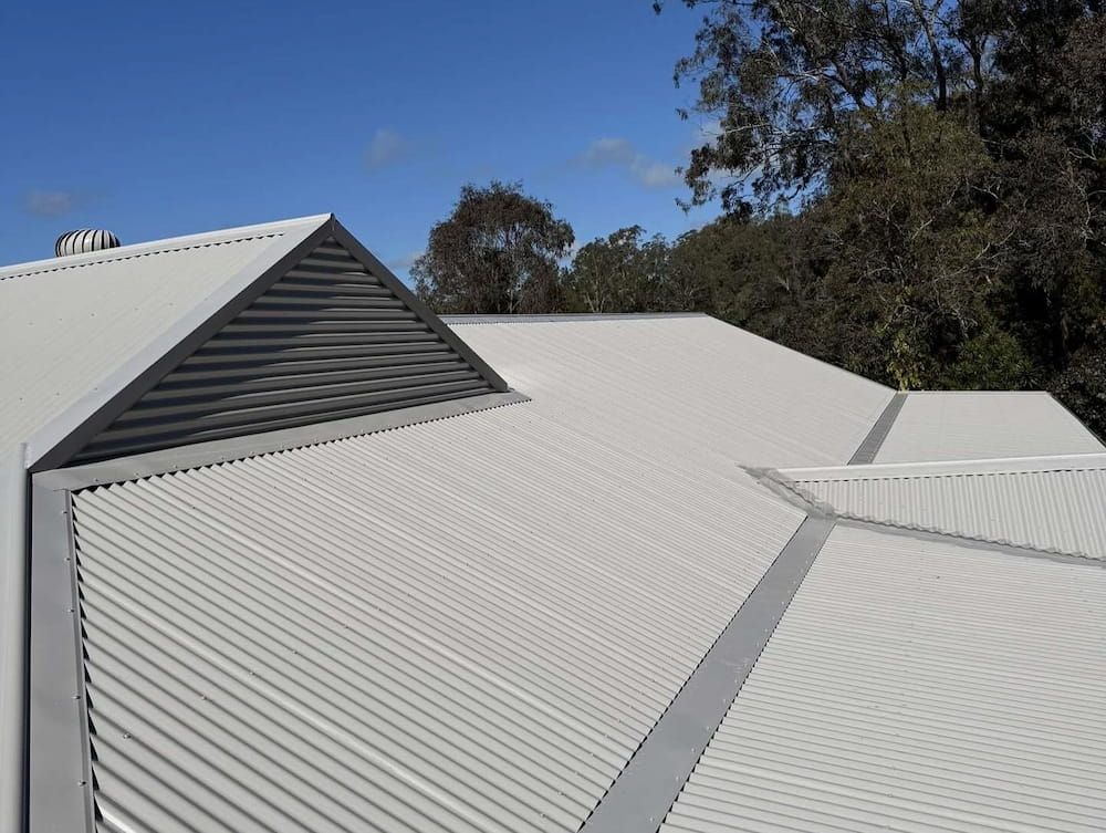 White Corrugated Metal Roof Under a Blue Sky — Ace1 Metal Roofing in Taree, NSW