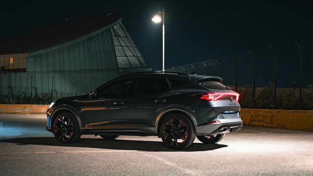 A Car Is Parked in A Parking Lot at Night — Latin Motors in Fyshwick, ACT