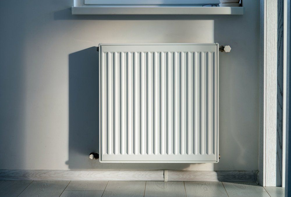 White Radiator — Milford, CT — Bloszko Plumbing & Heating White Radiator — Milford, CT — Bloszko Plumbing & Heating