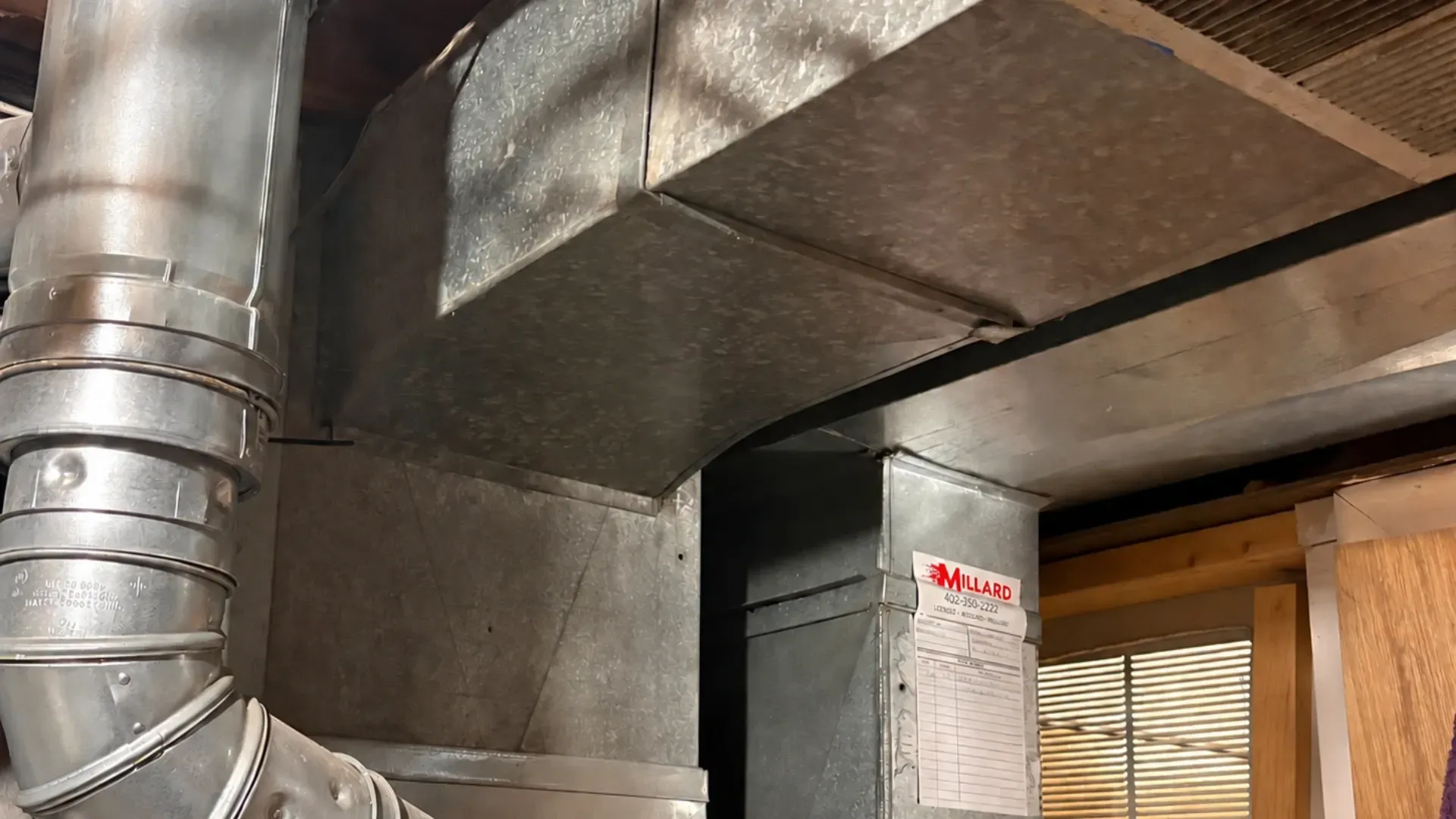 millard heating and cooling sticker on hvac duct repair job