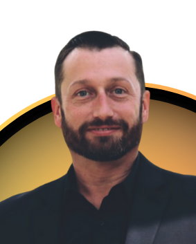 A man with a beard is wearing a black shirt