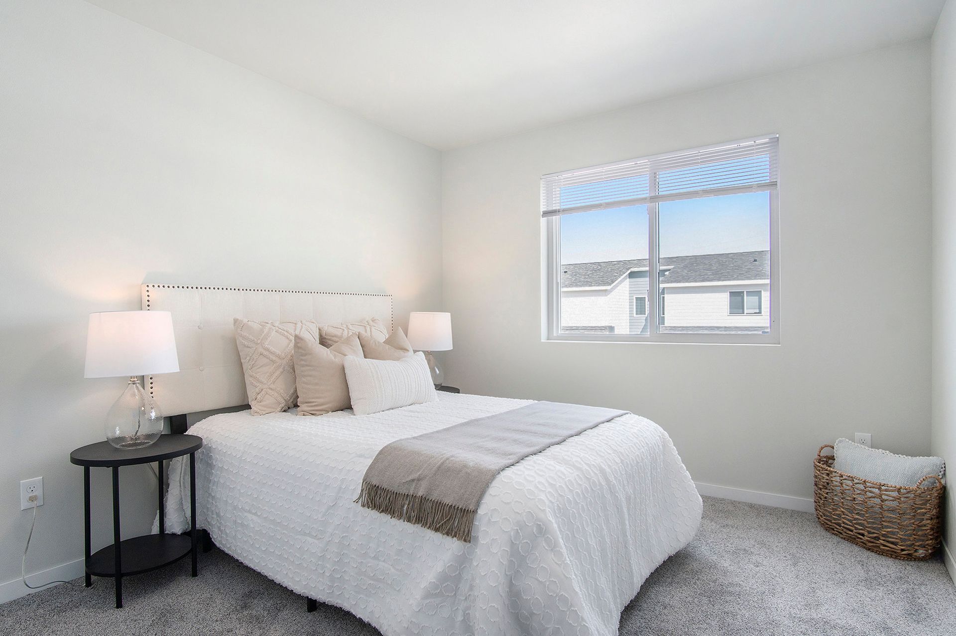 A bedroom with a window.