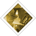 Person at a desk, with a phone and a computer, in a sepia-toned room.