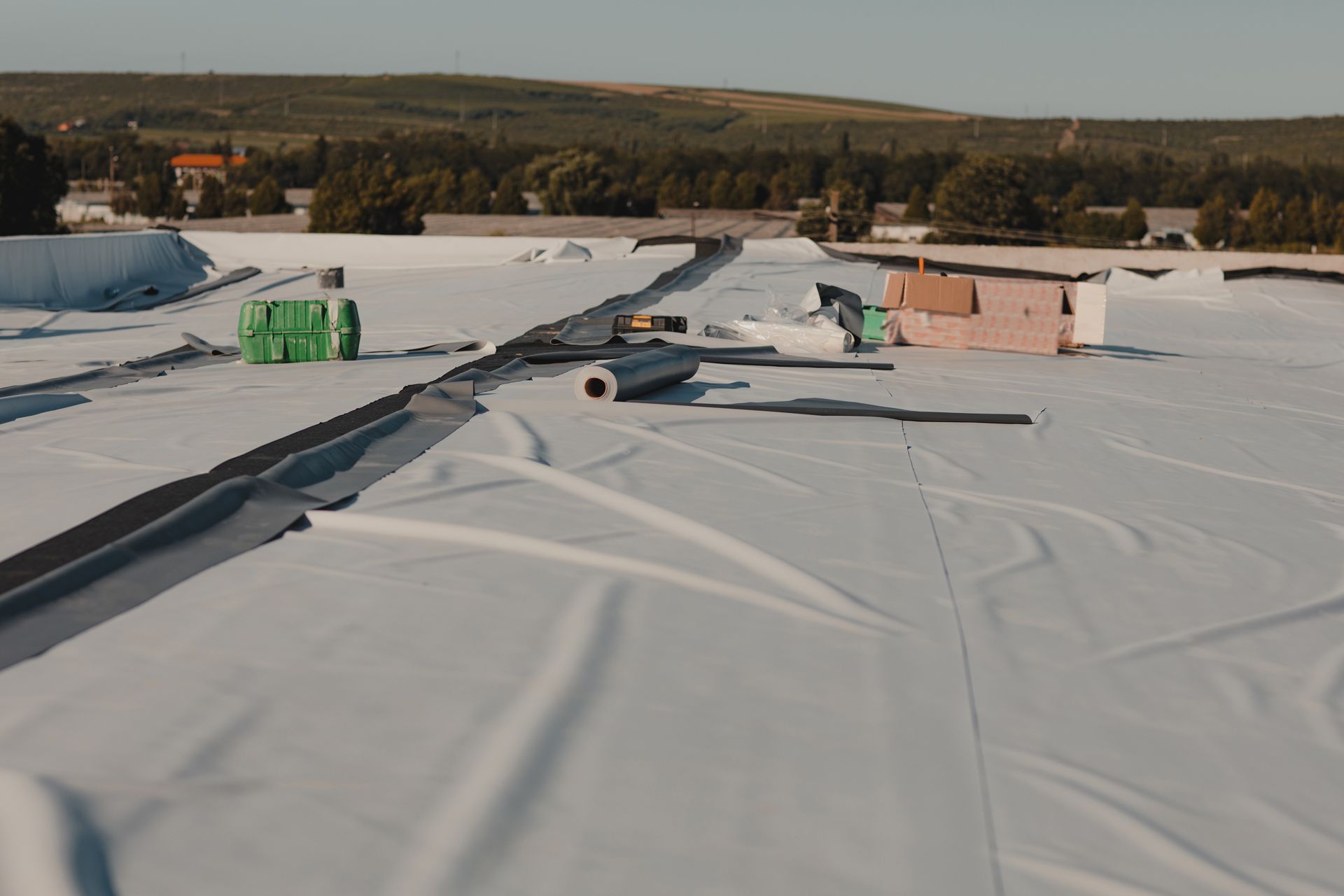 A White Roof is Being Installed on a Building