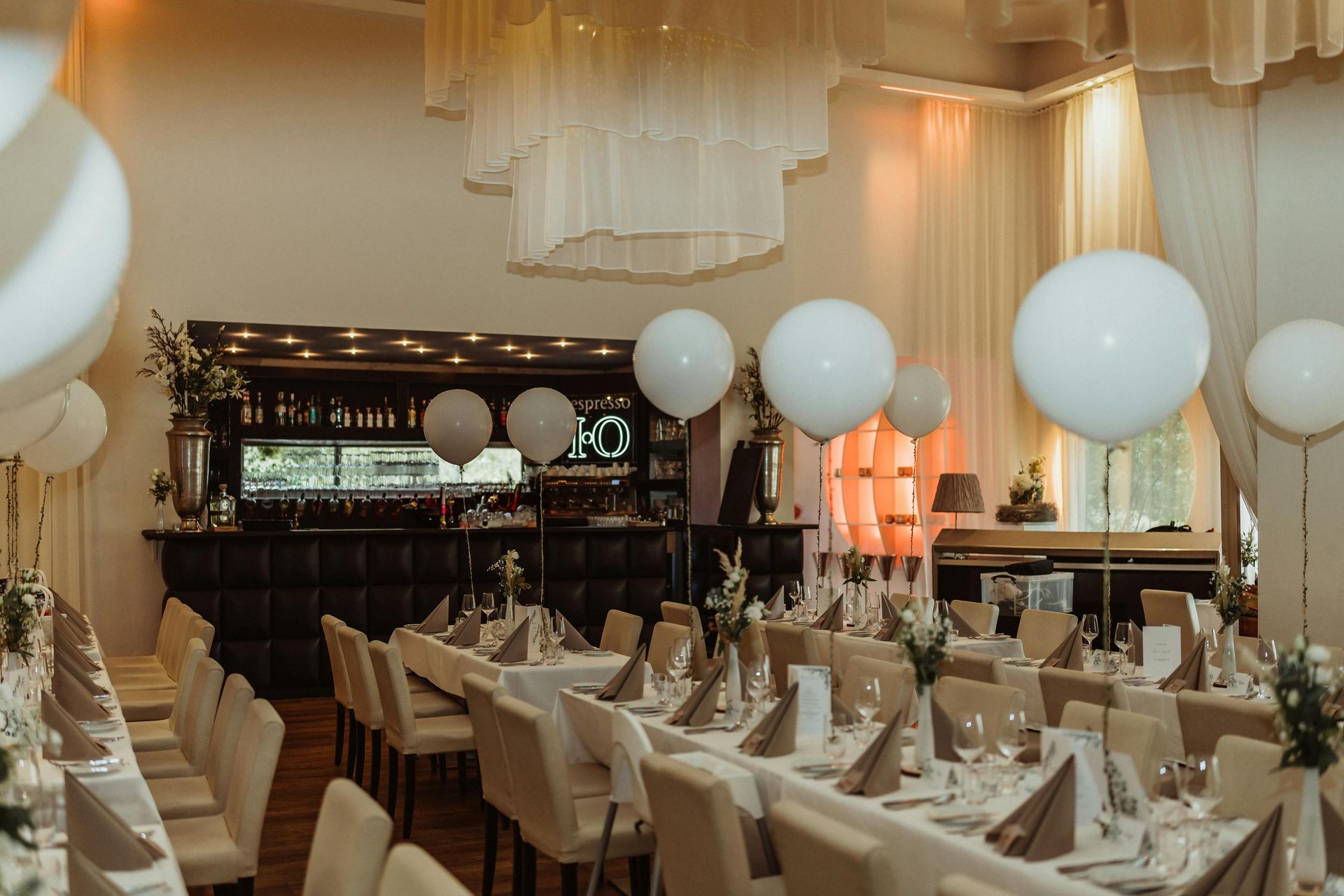 corporate event with white balloons