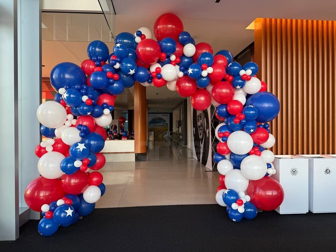 red white and blue balloon arch