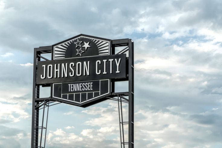 Johnson City, Tennessee roadside sign against a cloudy sky